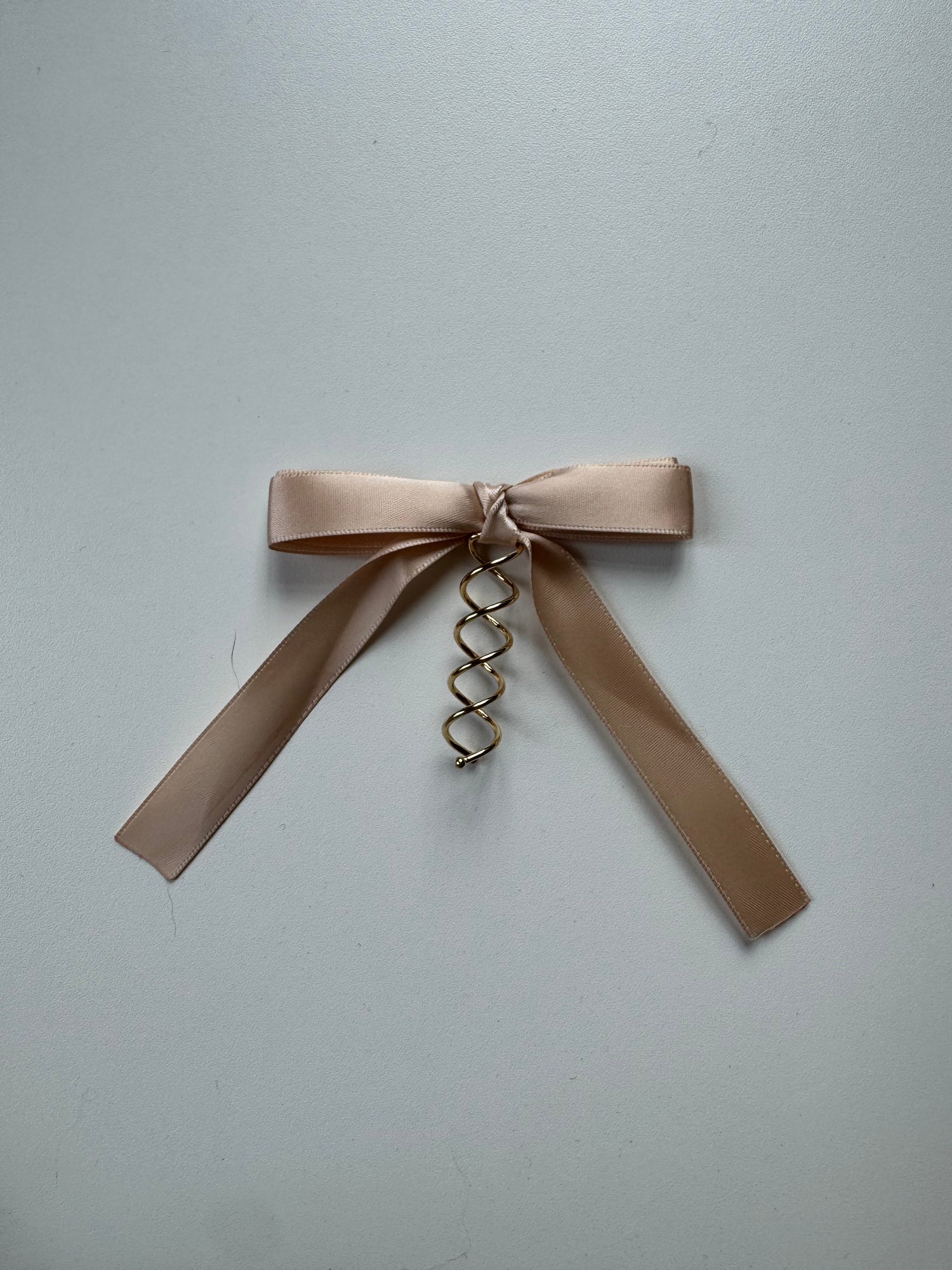 Échantillon - Boucle crème rosée sur spirale